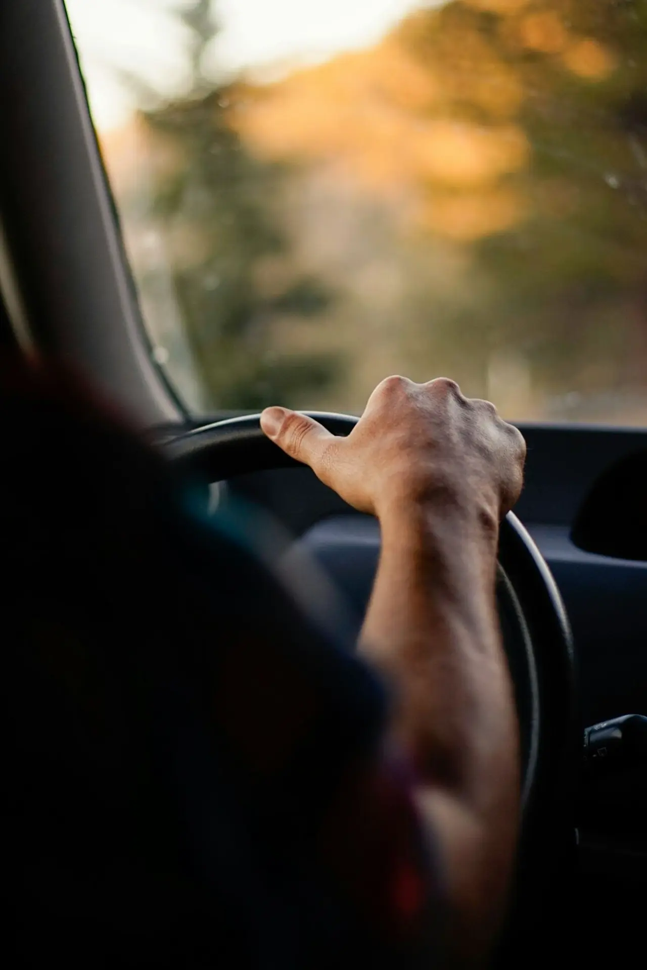 person driving car during daytime